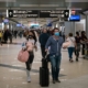 Flyers at Hartsfield-Jackson Atlanta International Airport wearing facemasks on March 6th, 2020 as the COVID-19 coronavirus spreads throughout the United States.